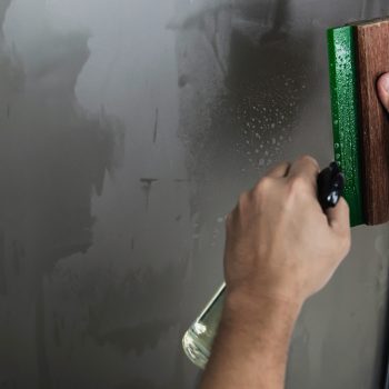 People installing sticker film to mirror window house interior decoration